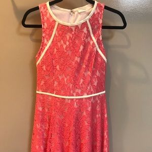 Pink lacy dress with white piping
